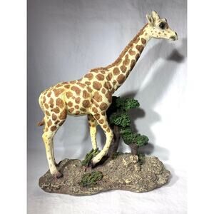 Resin Sculpture Giraffe Standing By Tree